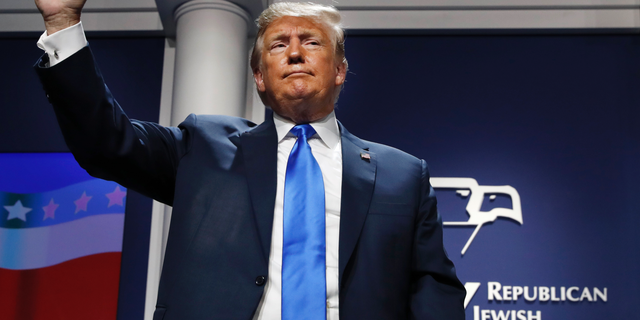 President Donald Trump holds up his fist as he finishes his speech at the Republican Jewish Coalition's annual leadership meeting, Saturday April 6, 2019, in Las Vegas. (AP Photo/Jacquelyn Martin)
