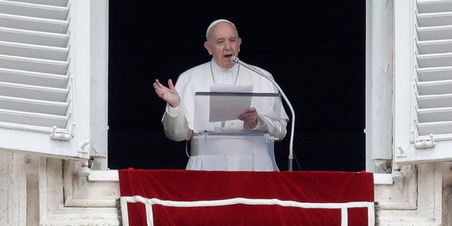 Pope Francis delivers his speech during the Regina Coeli noon prayer from the window of his studio overlooking St. Peter's Square, at the Vatican, on Sunday.