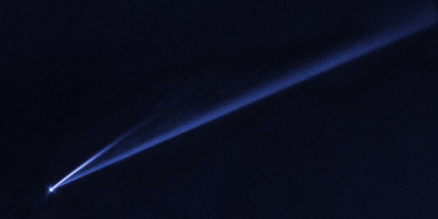 This Hubble Space Telescope image reveals the gradual self-destruction of the asteroid (6478) Gault, whose ejected dusty material has formed two long, thin, comet-like tails. The longer tail stretches more than 500,000 miles (800,000 kilometers) and is roughly 3,000 miles (4,800 km) wide. The shorter tail is about a quarter as long. The streamers will eventually disperse into space.