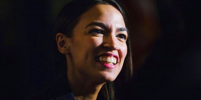 FILE - In this Saturday, Feb. 16, 2019 file photo, Rep. Alexandria Ocasio-Cortez, D-N.Y., delivers her inaugural address following her swearing-in ceremony at the Renaissance School for Musical Theater and Technology in the Bronx borough of New York. (AP Photo/Kevin Hagen, File)