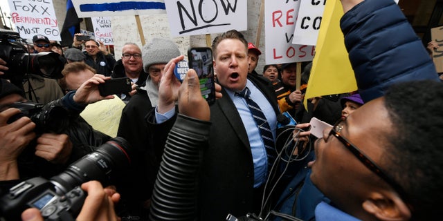 Dueling protestors speaking out Monday in Chicago over Cook County State's Attorney Kim Foxx's office's decision to drop all charges against "Empire" actor Jussie Smollett. (AP Photo/Paul Beaty)