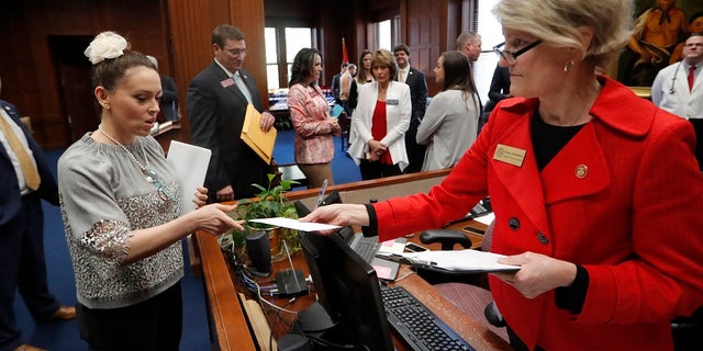 Actress Alyssa Milano, left, delivers a letter to Georgia Gov. Brian Kemp's office detailing her opposition to HB 481 at the State Capitol Tuesday, April 2, 2019, in Atlanta. HB 481 would ban almost all abortions after a fetal heartbeat can be detected. (Associated Press)