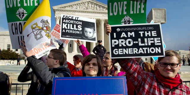 FILE - In this Jan. 18, 2019, file photo, anti-abortion activists protest outside of the U.S. Supreme Court, during the March for Life in Washington. A committee in Texas considered a bill this week that would have opened the door to put women to death for their abortions. 