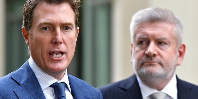 Australia's Attorney-General Christian Porter, left, and Minister for Communications Mitch Fifield hold a press conference at Parliament House, in Canberra, Wednesday, April 4, 2019. (Mick Tsikas/AAP Image via AP)