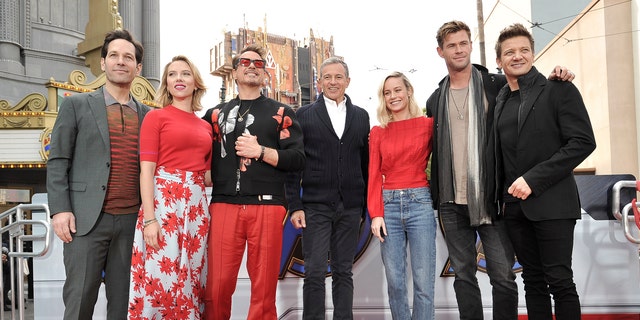 The actors behind the superhero team were photographed during the event with Iger.