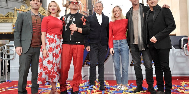 The actors behind the team of superheroes were photographed at the event with Iger.