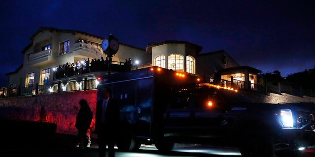 People watch from Trump National Golf Club Los Angeles at dusk as the Marine One helicopter carrying President Donald Trump arrives in Rancho Palos Verdes, Calif., Friday, April 5, 2019. (Associated Press)