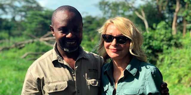 Kimberly Endicott with her guide, JP Mirenge Remezo, a day after they were rescued following a kidnapping by unknown gunmen in Uganda's Queen Elizabeth National Park. 