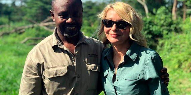 Kimberly Endicott with her guide, JP Mirenge Remezo, a day after they were rescued following a kidnapping by unknown gunmen in Uganda's Queen Elizabeth National Park. 