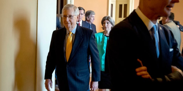 Senate Majority Leader Mitch McConnell of Ky., arrives to speak to members of the media following a Senate policy luncheon on Capitol Hill, Tuesday, April 9, 2019, in Washington. (AP Photo/Andrew Harnik)