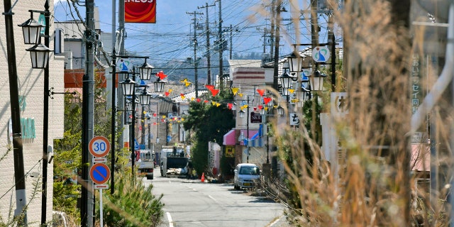 This April 9, 2019, photo shows central area of Okuma town, Fukushima. Japan has partially lifted an evacuation order in one of the two hometowns of the tsunami-wrecked Fukushima nuclear plant for the first time since the 2011 disaster. The action taken Wednesday, April 10, 2019, allows people to return about 40 percent of Okuma. The area seen in this photo is still under evacuation order. (Kyodo News via AP)