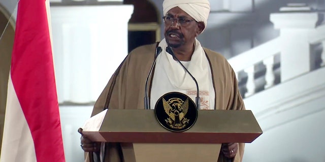 FILE - In this file image taken from video, Sudan's President Omar al-Bashir speaks at the Presidential Palace, Friday, Feb. 22, 2019, in Khartoum, Sudan. Tens of thousands of Sudanese were making their way to the center of the country’s capital on Thursday, April 11, 2019, cheering and clapping in celebration as two senior officials said the military had forced longtime autocratic President Omar al-Bashir to step down after 30 years in power.(AP Photo/Mohamed Abuamrain, File)