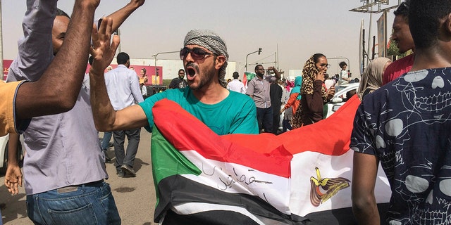 Sudanese celebrate after officials said the military had forced longtime autocratic President Omar al-Bashir to step down after 30 years in power in Khartoum, Sudan, Thursday, April 11, 2019. (AP Photo)