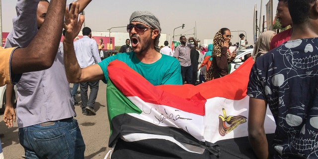 Sudanese celebrate after officials said the military had forced longtime autocratic President Omar al-Bashir to step down after 30 years in power in Khartoum, Sudan, Thursday, April 11, 2019. (AP Photo)