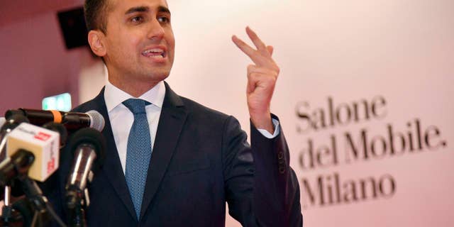 Italian Deputy Premier and Labour and Industry Minister, Luigi Di Maio, gestures while attending a press conference during his visit to the Salone del Mobile Furniture Fair, near Milan, Italy, Friday, April 11, 2019.