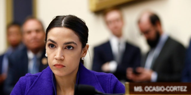 Rep. Alexandria Ocasio-Cortez, D-N.Y., listens during a House Financial Services Committee hearing with leaders of major banks on Capitol Hill in Washington. (AP Photo/Patrick Semansky, File)
