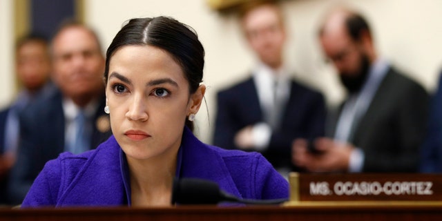 Rep. Alexandria Ocasio-Cortez, D-N.Y., listens during a House Financial Services Committee hearing with leaders of major banks on Capitol Hill in Washington. (AP Photo/Patrick Semansky, File)