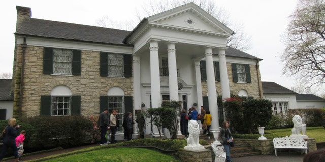 This March 13, 2017, photo shows visitors getting ready to tour Graceland in Memphis, Tennessee.   