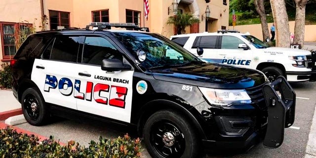 This undated photo provided by the Laguna Beach Police Department shows their newly decorated Police SUV patrol vehicles in Laguna Beach, Calif. Seven out of the department's 11 cars have already been painted, the department said in a text to the Los Angeles Times.