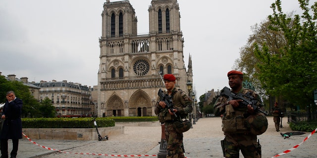 Firefighters declared success Tuesday in a more than 12-hour battle to extinguish an inferno engulfing Paris' iconic Notre Dame cathedral that claimed its spire and roof, but spared its bell towers. (AP Photo/Francois Mori)