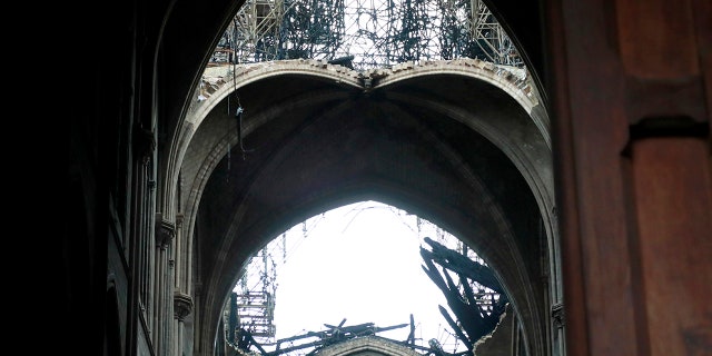 A hole is seen in the dome inside Notre cathedral in Paris. (Christophe Petit Tesson, Pool via AP)
