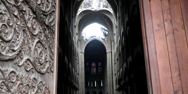 Firefighters declared success Tuesday in a more than 12-hour battle to extinguish an inferno engulfing Paris' iconic Notre Dame cathedral that claimed its spire and roof, but spared its bell towers and the purported Crown of Christ.