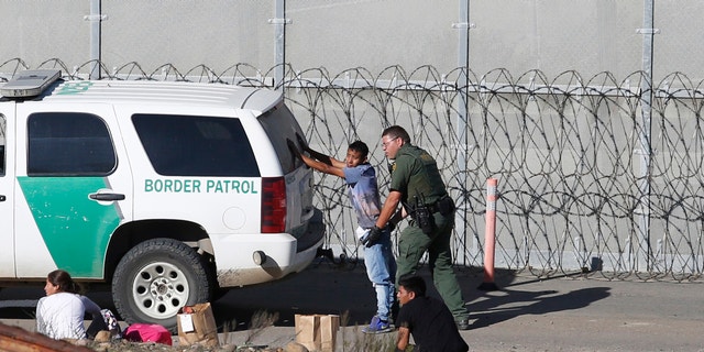 Honduran asylum seekers were arrested by US Border Patrol officers in San Diego during the last Demceber. (AP Photo / Moises Castillo, File)