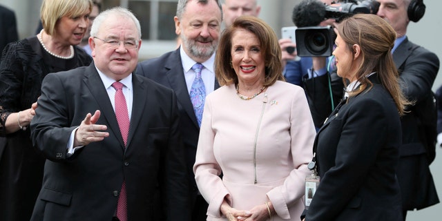 US House of Representatives speaker Nancy Pelosi is greeted by Chairperson of the lower house of parliament Sean O Fearghail, left, on arrival at Leinster House in Dublin to deliver an address in Dublin, Ireland, Wednesday April 17, 2019. (Brian Lawless, via AP)