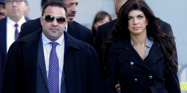FILE - In this Nov. 20, 2013, file photo, Giuseppe "Joe" Giudice, left, and his wife, Teresa Giudice, of Montville Township, N.J., walk out of Martin Luther King Jr. Courthouse after a court appearance, in Newark, N.J. On Thursday, April 18, 2019. Attorneys for Joe Giudice said that their client has lost his appeal to avoid deportation to Italy. (AP Photo/Julio Cortez, File)