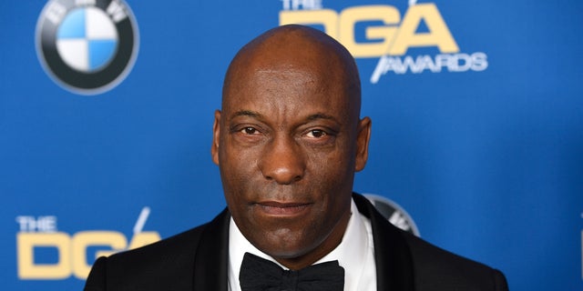 FILE - In this Feb. 3, 2018 file photo, John Singleton arrives at the 70th annual Directors Guild of America Awards in Beverly Hills, Calif. The "Boyz n the Hood" director suffered a stroke last week and remains hospitalized, according to a statement from his family.