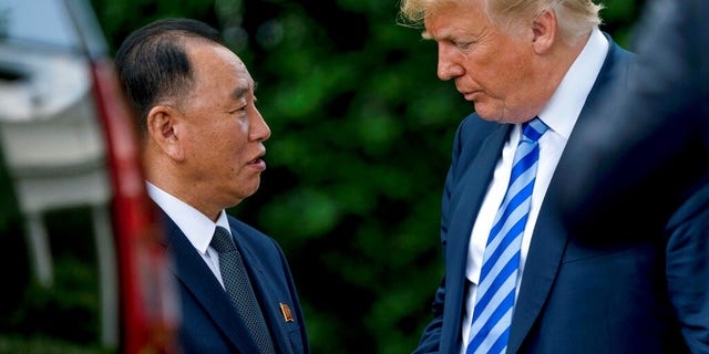 President Donald Trump shakes hands with Kim Yong Chol, former North Korean military intelligence chief and one of leader Kim Jong Un's closest aides.