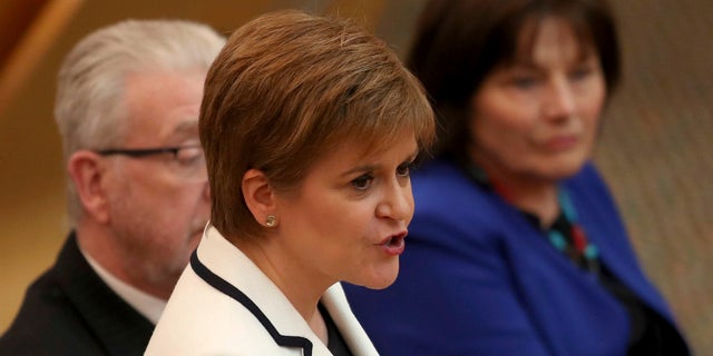 First Minister of Scotland Nicola Sturgeon issues a statement on Brexit and independence in the main chamber at the Scottish Parliament, Edinburgh, Wednesday April 24, 2019. (Jane Barlow/PA via AP)