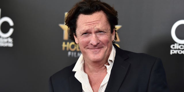FILE - In this Nov. 1, 2015 file photo, Michael Madsen arrives at the Hollywood Film Awards at the Beverly Hilton Hotel in Beverly Hills, Calif. Prosecutors have charged Madsen with two misdemeanor counts of drunken driving after the actor drove his SUV into a pole last month.