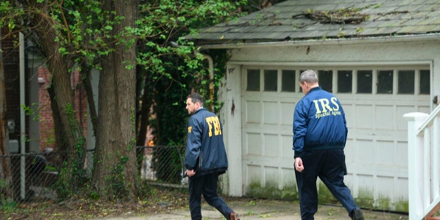 Federal Bureau of Investigation, and Internal Revenue Service agents search the home of Baltimore Mayor Catherine Pugh in Baltimore, MD., Thursday, April 25, 2019. Agents with the FBI and IRS are gathering evidence inside the two homes of Baltimore Mayor Catherine Pugh and in City Hall.