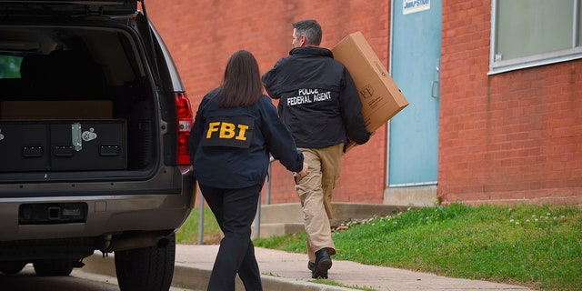 Federal agents arrive at the Maryland Center for Adult Training in Baltimore. MD, Thursday, April 25, 2019. Agents with the FBI and IRS are gathering evidence inside the two homes of Baltimore Mayor Catherine Pugh and in City Hall, as well as the office of her lawyer and the home of a top aide.