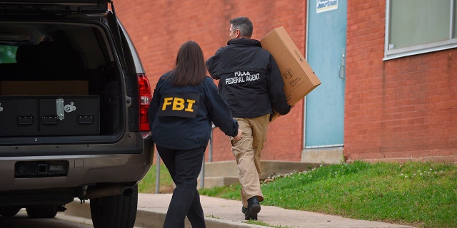 Federal agents arrive at the Maryland Center for Adult Training in Baltimore. MD, Thursday, April 25, 2019. Agents with the FBI and IRS are gathering evidence inside the two homes of Baltimore Mayor Catherine Pugh and in City Hall, as well as the office of her lawyer and the home of a top aide.
