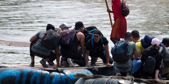 Migrants cross the border between Mexico and Guatemala on a raft crossing the Suchiate River near Ciudad Hidalgo, in the state of Chiapas, Mexico, on Saturday, April 27, 2019. Thousands of migrants remain at the border southern Mexico, while waiting for documents allowing them to remain legally in the country. (AP Photo / Moises Castillo)