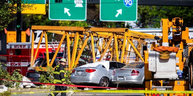 Emergency crews are working on the site of a construction crane collapse near the intersection of Mercer Street and Fairview Avenue near Interstate 5 in Seattle.