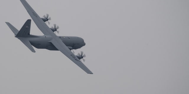 A C-130J Super Hercules with the 36th Airlift Squadron flies over Yokota Air Base, Japan, March 6, 2016.
