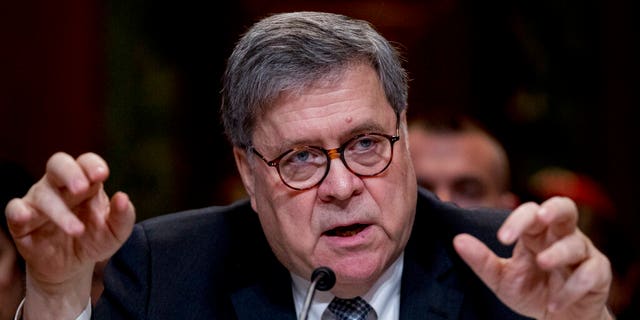 Attorney General William Barr reacts as he appears before a Senate Appropriations subcommittee to make his Justice Department budget request, Wednesday, April 10, 2019, in Washington. Barr said Wednesday that he was reviewing the origins of the Trump-Russia investigation. He said he believed the president's campaign had been spied on and he was concerned about possible abuses of government power. (AP Photo/Andrew Harnik)