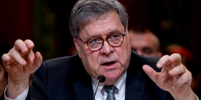 Attorney General William Barr reacts as he appears before a Senate Appropriations subcommittee to make his Justice Department budget request, Wednesday, April 10, 2019, in Washington. Barr said Wednesday that he was reviewing the origins of the Trump-Russia investigation. He said he believed the president's campaign had been spied on and he was concerned about possible abuses of government power. (AP Photo/Andrew Harnik)