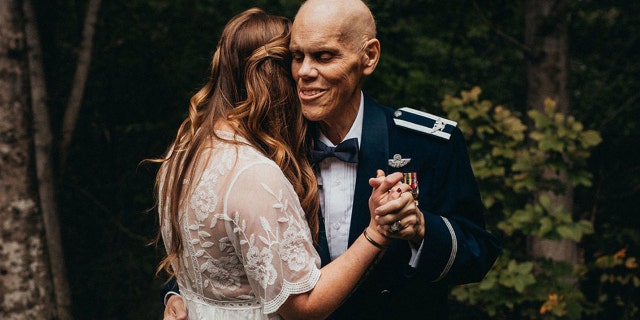 The Virginia woman looked lovely in her wedding gown, her veteran father handsome in his U.S. Air Force dress blues.