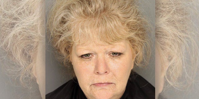Decades after a newborn girl was found dead in a vacuum cleaner box at a South Carolina vacant lot, a woman who's believed to have been the child's birth mother was arrested and charged, police said Thursday.