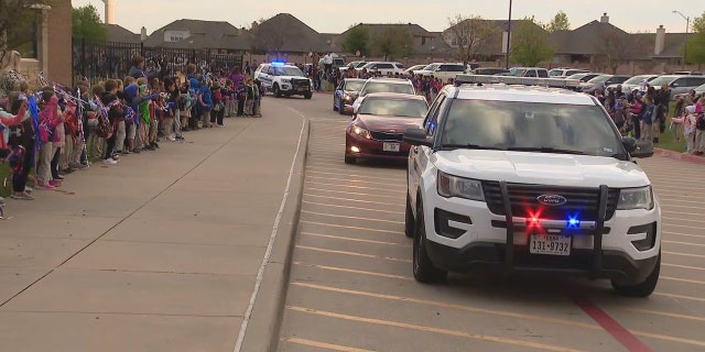Burleson's police and the Texas escort. (Fox 4)