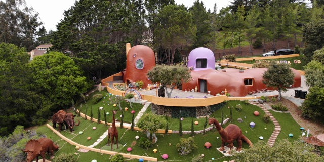 The San Francisco Bay Area suburb of Hillsborough is suing the owner of the so-called Flintstone House, saying that she installed dangerous steps, dinosaurs and other Flintstone-era figurines without necessary permits.