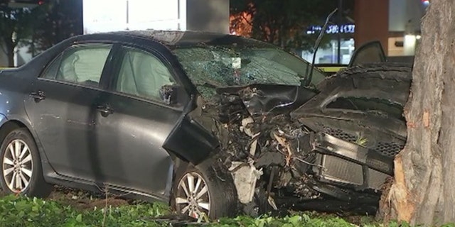 The damaged car can be seen after ramming into 8 people on the sidewalk in Sunnyvale, California on Tuesday.