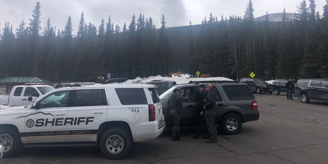 The Clear Creek County Sheriff's vehicles can be seen near Echo Lake, Colorado, where Sol Pais was found dead on Wednesday.