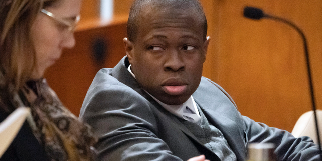 FILE - In this Tuesday, March 26, 2019, file photo, defendant Chanel Lewis, right, is seated at the defense table at Supreme Court in the Queens Borough of New York, on the sixth day of his retrial for the August 2016 murder of Karina Vetrano. On Monday, April 1, 2019, a jury convicted Lewis of the murder. A previous trial ended in a hung jury. (Charles Eckert/Newsday via AP, Pool, File)