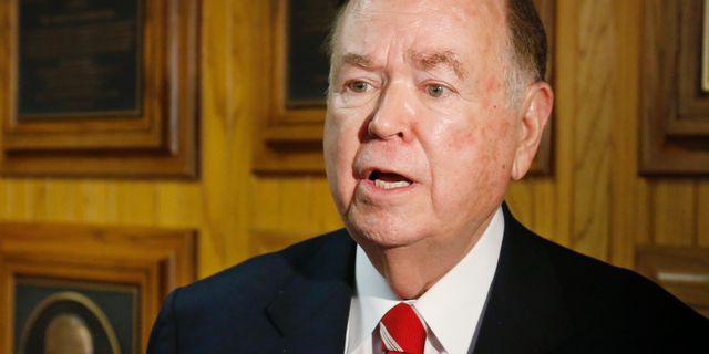 FILE - In this March 10, 2015 file photo, University of Oklahoma President David Boren talks with the media before the start of a Board of Regents meeting in Oklahoma City. The attorney for Boren says Boren has met with investigators looking into allegations he sexually harassed male subordinates. Attorney Clark Brewster told The Oklahoman that Boren met Friday, April 5, 2019 with investigators and answered all of their questions, but Brewster declined to discuss specific questions. (AP Photo/Sue Ogrocki, File)