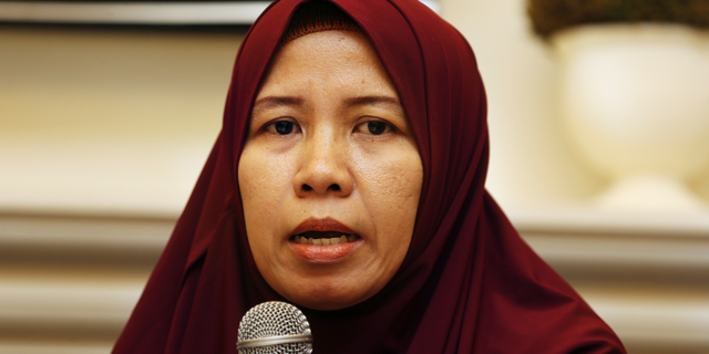 Merdian Agustin family of a victim of the Lion Air jet that crashed into the Java Sea talks to journalists during a press conference in Jakarta, Monday, April 8, 2019. More families of victims of the Lion Air crash in Indonesia are suing Boeing Co. after its chief executive apologized last week and said a software update for the MAX 8 jet would prevent further disasters. (AP Photo/Achmad Ibrahim)